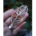 Brass feather brooch with amber