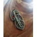 Brass feather brooch with amber