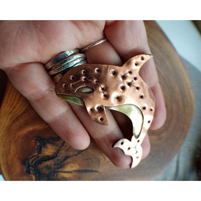 Copper killer whale brooch