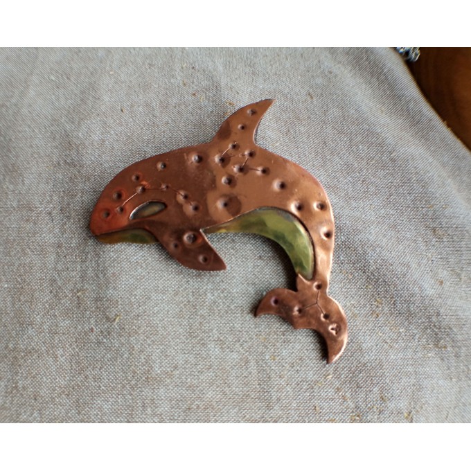Copper killer whale brooch