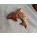 Copper killer whale brooch