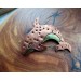 Copper killer whale brooch
