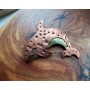 Copper killer whale brooch