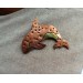 Copper killer whale brooch