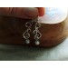 Silver earrings with white pearls