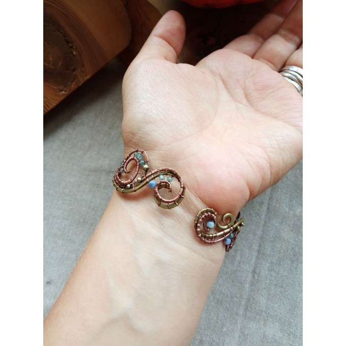 Wire wrap bracelet with copper feather and gemstone beads