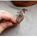 Wire wrap bracelet with copper feather and gemstone beads
