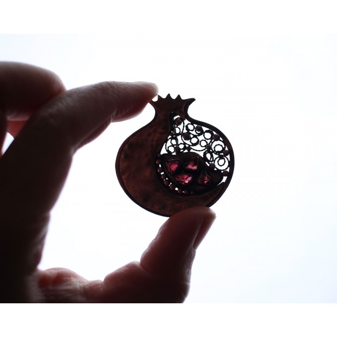 Copper filigree pomegranate brooch with garnet