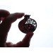 Copper filigree pomegranate brooch with garnet