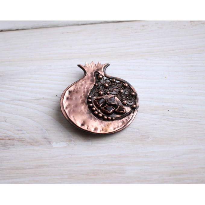 Copper filigree pomegranate brooch with garnet