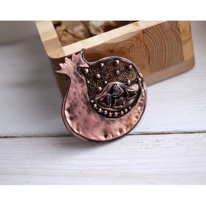 Copper filigree pomegranate brooch with garnet