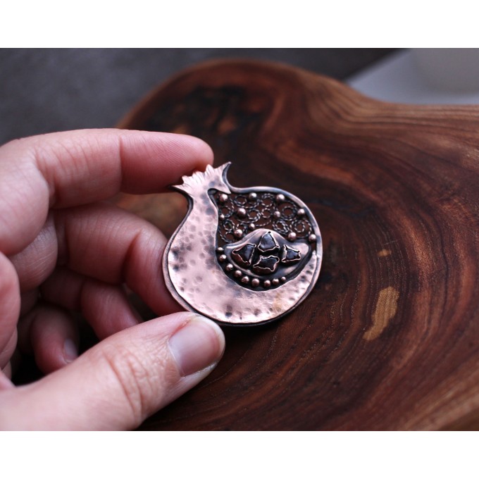 Copper filigree pomegranate brooch with garnet