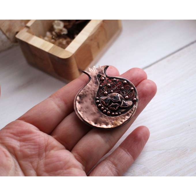 Copper filigree pomegranate brooch with garnet