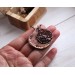 Copper filigree pomegranate brooch with garnet