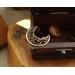 Copper and brass filigree moon broch
