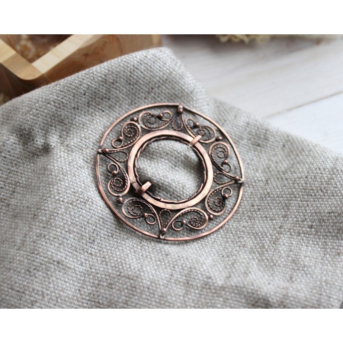 Copper filigree brooch