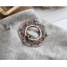 Copper filigree brooch