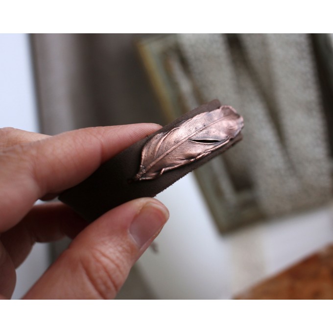 Leather bracelet with copper feather