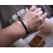 Leather bracelet with copper feather