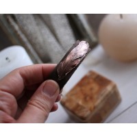Leather bracelet with copper feather
