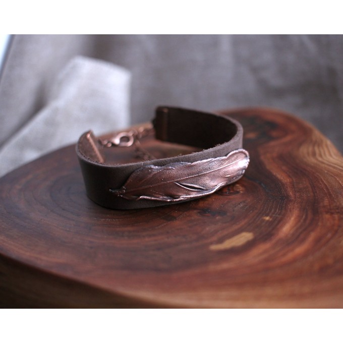 Leather bracelet with copper feather