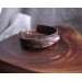 Leather bracelet with copper feather