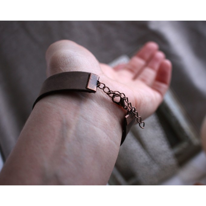 Leather bracelet with copper feather