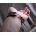 Leather bracelet with copper feather