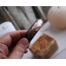 Leather bracelet with copper feather
