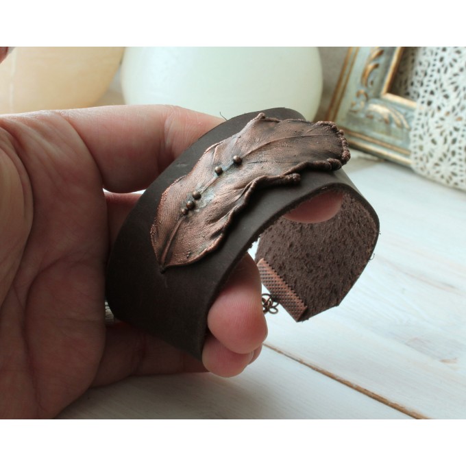 Leather bracelet with copper feather
